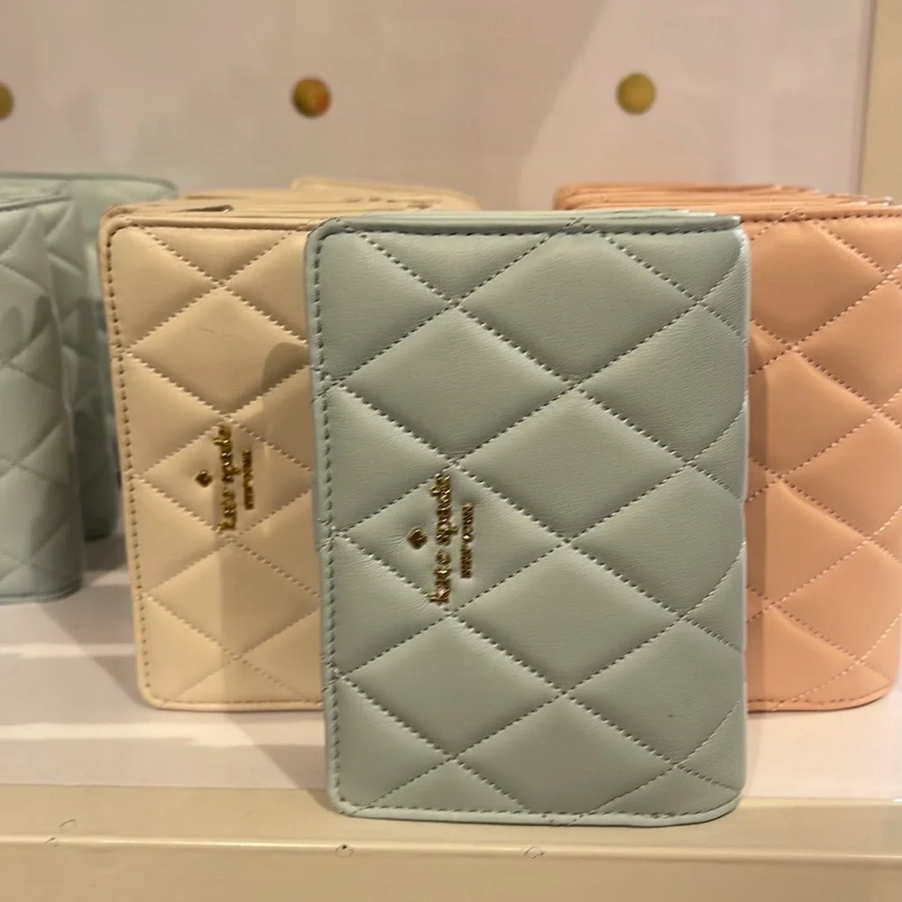 Kate Spade Carey Medium Compartment Bifold Wallet 
COLOR: Turquoise - Picture 15 of 16